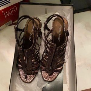 Used once Brown size 51/2 M 2 inches high healed shoes